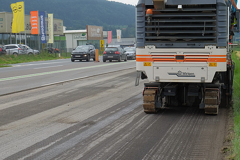 Milling machine removes the asphalt surface