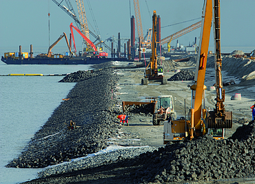 Close-up of a large building site with various construction machines