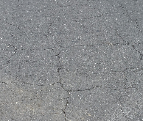 Close-up of cracks in the road